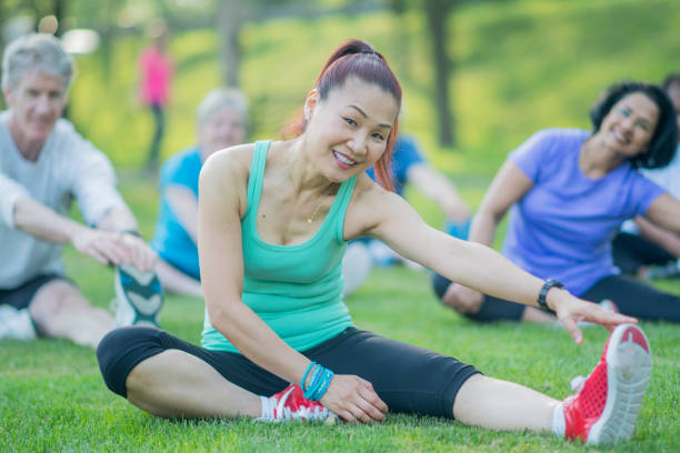 istock Elderly Woman Excercises with Group 801309774