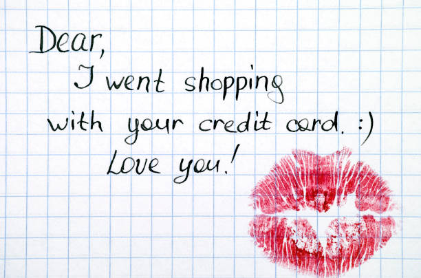 note - dear, i went shopping with  your credit card. love you! with kiss. - stealing a kiss imagens e fotografias de stock