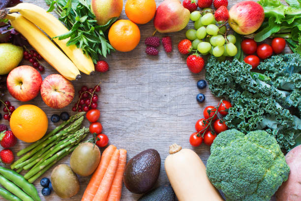 istock Different fruits and vegetables on wooden table 801322178