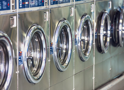 Washers and dryers in downtown laundromat.