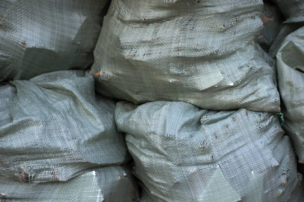 istock A pile of sacks with construction debris, carrying out repairs 801327110