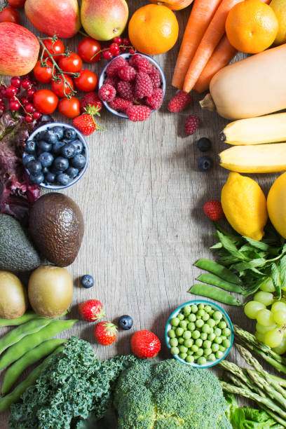 istock Different fruits and vegetables on wooden table 801327390