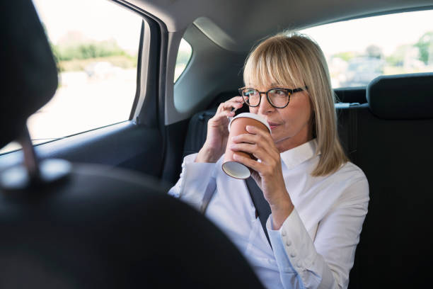 istock Mature businesswoman at car 801329986