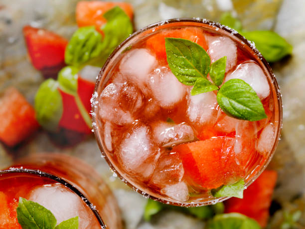Watermelon and Basil cocktail Watermelon and Basil cocktail with a hint of lemon and lime vodka soda top view stock pictures, royalty-free photos & images