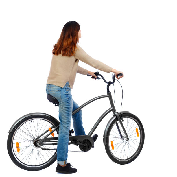 istock side view of a woman with a bicycle. 801350090