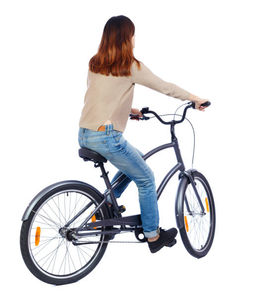 istock back view of a woman with a bicycle. 801351080