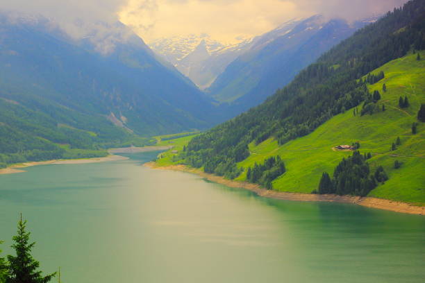 Mountain landscape at summer along the road to Rolle pass, Trento, Trentino Alto Adige, Italy. Lake