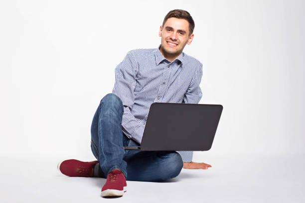 istock Business man with a laptop on a white background 801359282