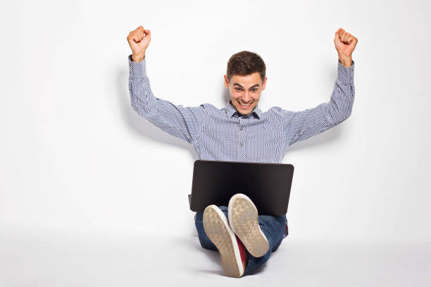 istock Business man with a laptop on a white background 801359316