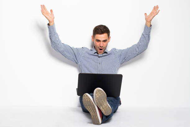 istock Business man with a laptop on a white background 801359330