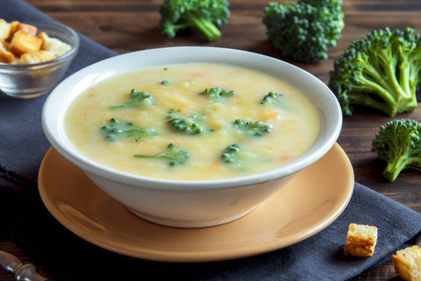 sopa de crema de queso con brócoli - carrot close up silverware cutting board fotografías e imágenes de stock