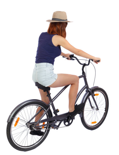 istock back view of a woman with a bicycle. 801363820