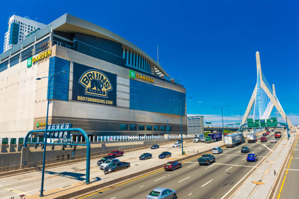 Boston, USA: View of TD Garden, Leonard P. Zakim Bunker Hill Bridge and highway with traffic in sunny summer day with clear blue sky stock photo