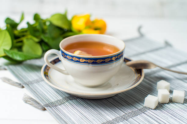 istock cups of tea with mint on wooden table 801377842
