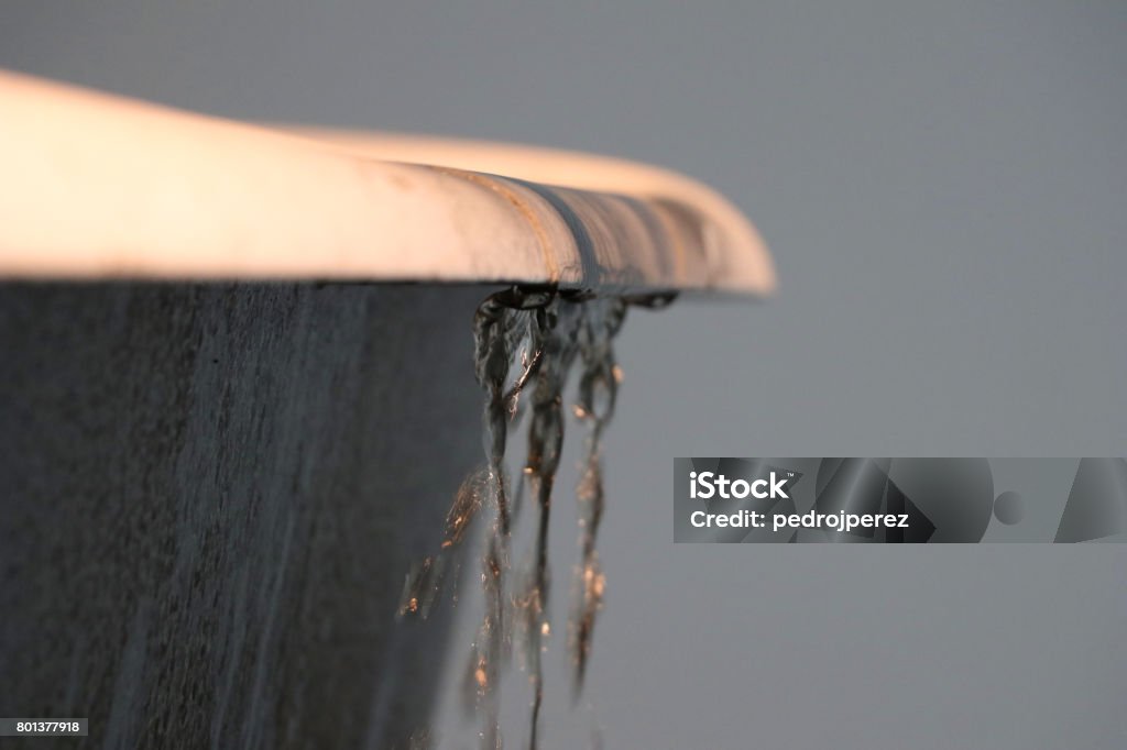 water spilling over a bathtub water spilling over a bathtub (close-up view) Overflowing Stock Photo