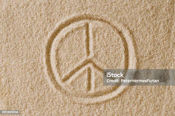 Peace Sign Drawn In Sand Macro Photo Stock Photo - Download Image Now - Austria, Brown, Cereal Plant