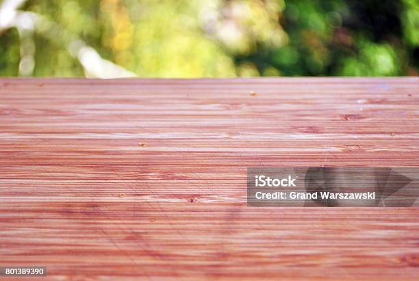 Wooden Board Empty Table In Front Of Blurred Background Stock Photo - Download Image Now