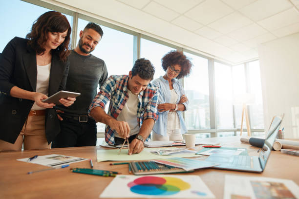 istock Team of professionals working together in creative office 801396840