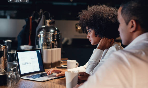 istock Business people working late on laptop 801405786