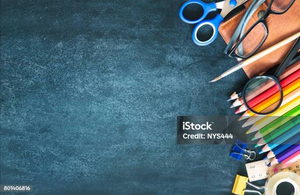 School Supplies On Black Board Background Empty Copy Space Stock Photo - Download Image Now