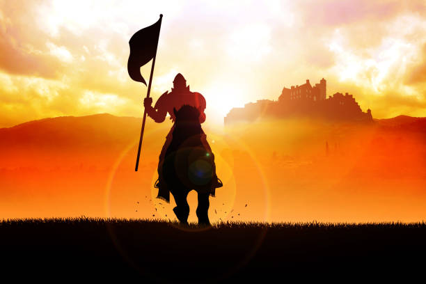 Medieval knight on horse carrying a flag Silhouette of a medieval knight on horse carrying a flag on dramatic scene knight person photos stock pictures, royalty-free photos & images