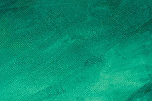 Textured green painted background Textured green winter painting canvas wallpaper background light green texture stock pictures, royalty-free photos & images