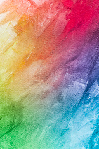 Textured abstract rainbow painting on canvas wallpaper background