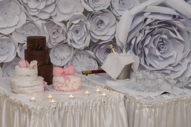 istock Wedding cakes and glasses of champagne 801456760