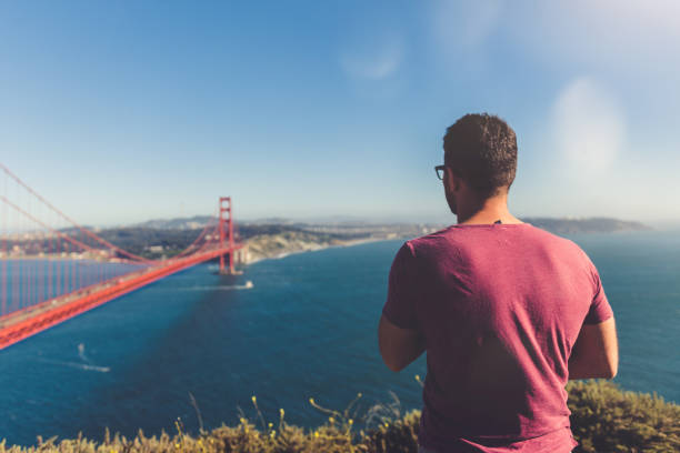 istock Young man at Golden Gate Bridge, San Francisco, USA 801460642