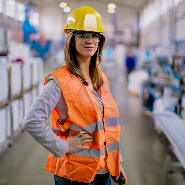 istock Beautiful young female engineer in the factory 801465416