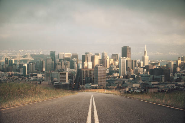istock Road leading to city 801468654