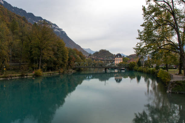 istock Aquamarine lake in alpine town 801553976
