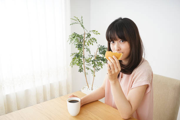 istock Young woman having a breakfast 801569298