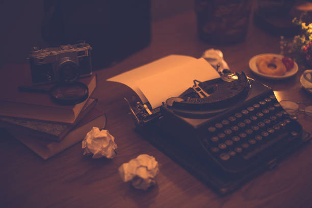 istock Close up and soft focus, old typewriter with vintage camera. 801578352