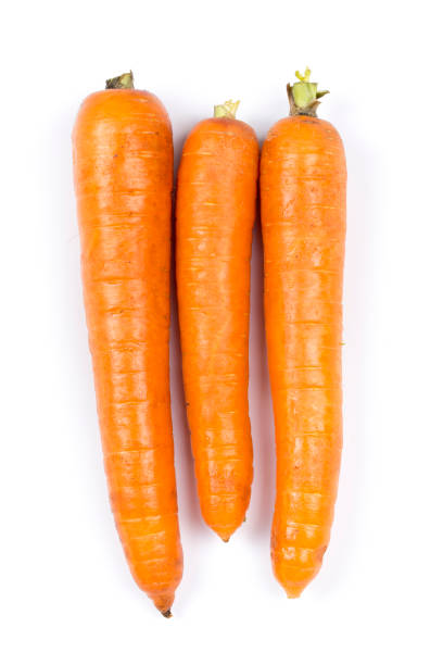 fresh carrots - carrot isolated white carotene imagens e fotografias de stock