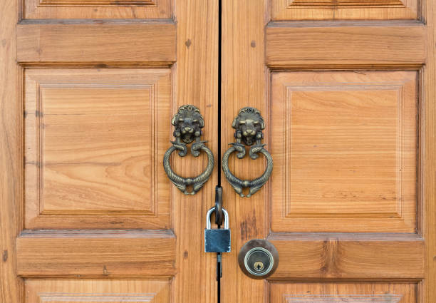 istock wooden door with handle and padlock 801597798