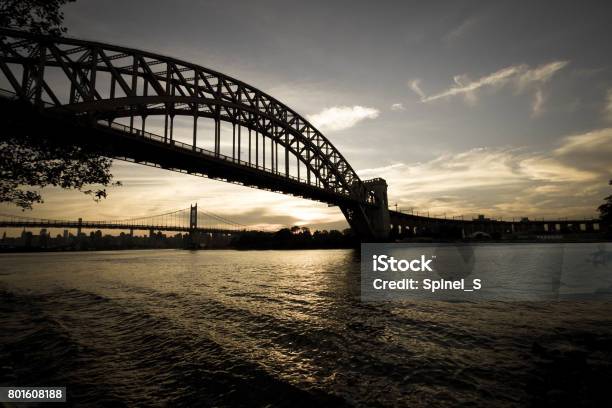 Dark Silhouette Of Hell Gate Bridge And Triborough Bridge Over The River In Vintage Style New York Stock Photo - Download Image Now