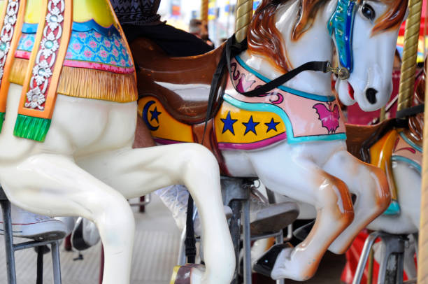 istock People Riding Carousel Horses At Amusement Park 801617456