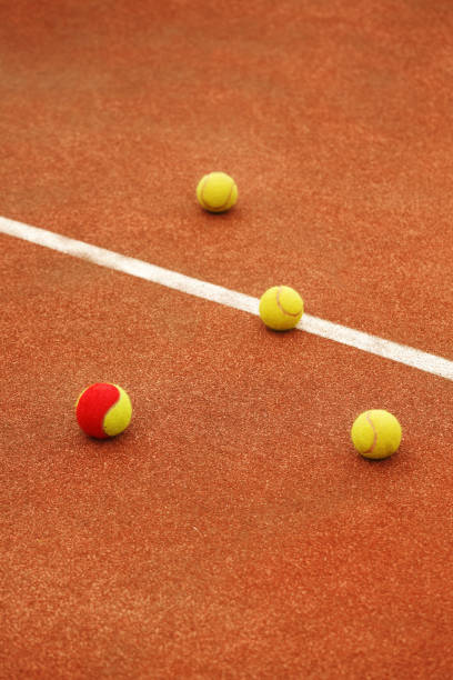 istock Ball on tennis court background 801617680