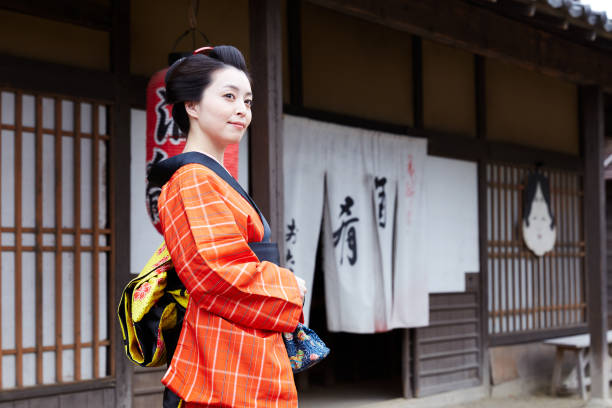 istock Young woman in a kimono waiting for her date 801644786