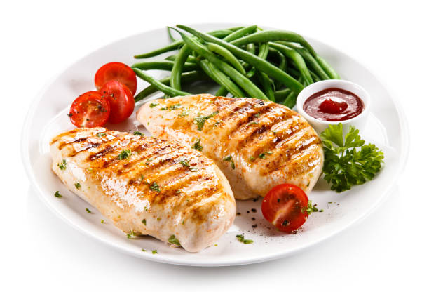 Grilled chicken fillet and vegetables Grilled chicken fillet and vegetables on white background chicken breast photos stock pictures, royalty-free photos & images