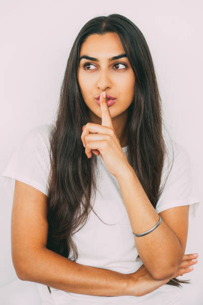 istock Beautiful young Indian woman having secret 801652954