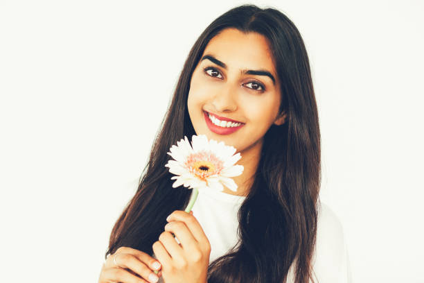 istock Romantic young woman holding gerbera 801653058