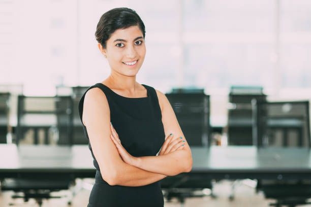istock Successful woman with crossed arms in office 801653072