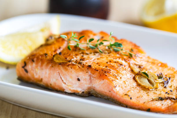 istock Grilled Salmon with Garlic and Herb by Lemon wedge 801655606