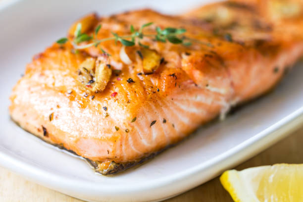 istock Grilled Salmon with Garlic and Herb by Lemon wedge 801655608