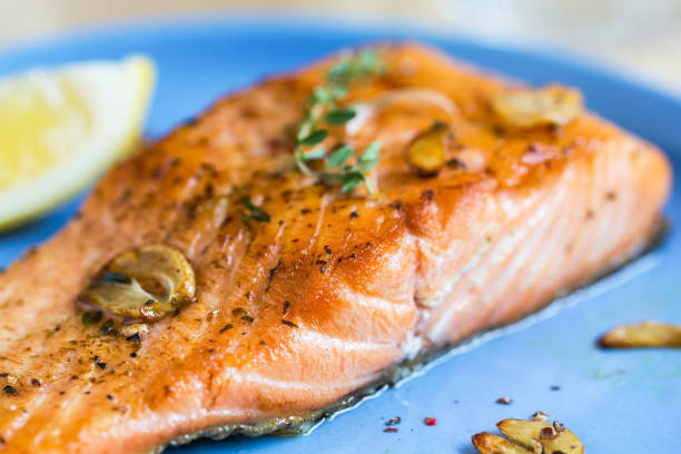 istock Grilled Salmon with Garlic and Herb by Lemon wedge 801655612