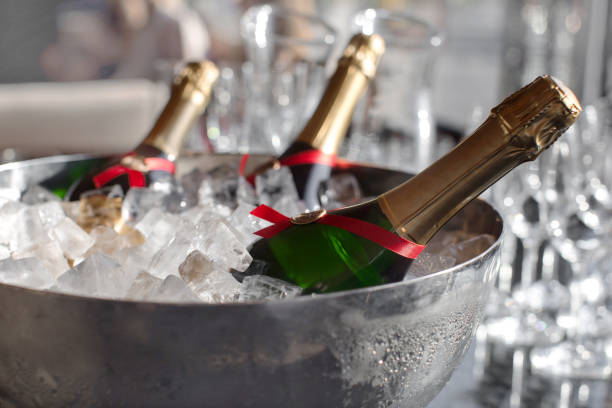 istock Three wine bottles chill in ice bucket 801655844