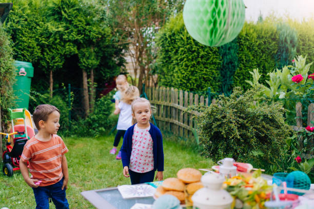 istock Cute Kids Having Fun Outside for Summer Backyard Party 801663746
