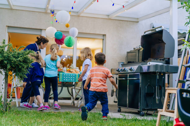 istock Cute Kids Having Fun Outside for Summer Backyard Party 801663808
